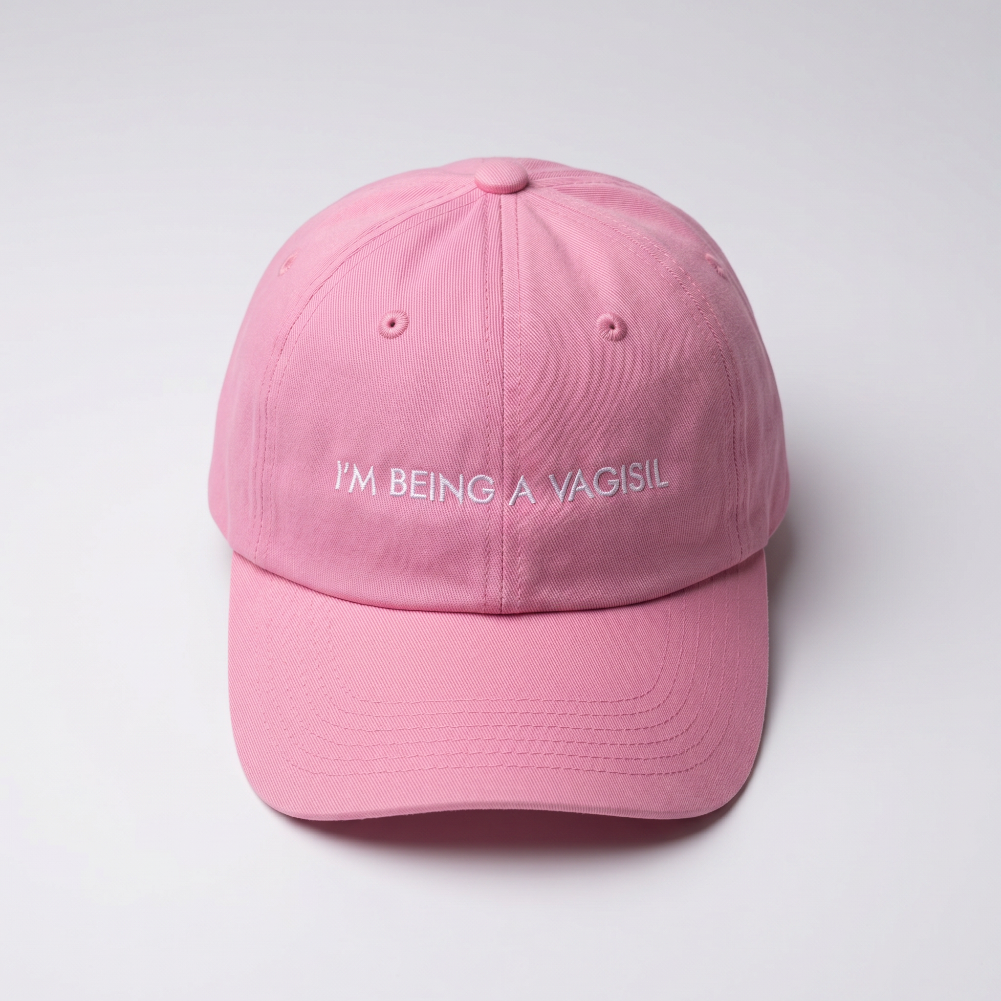 Pink cap with I'M BEING A VAGISIL text on a white backgroun
